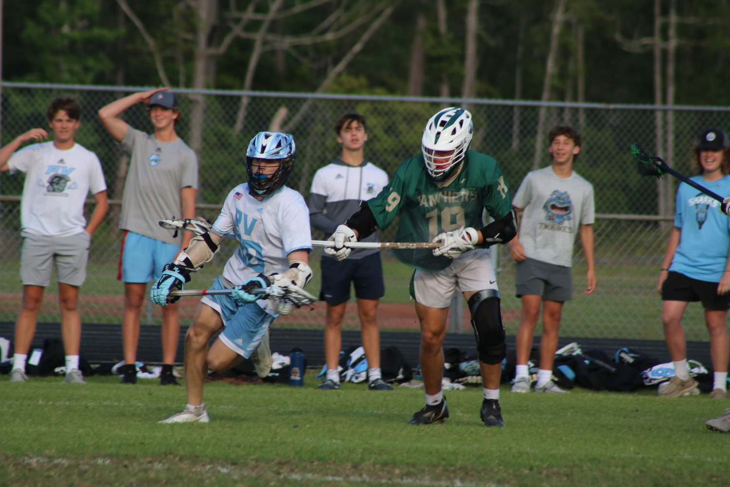 Ponte Vedra’s Maddox Johnson works to get past Nease’s Jordan McGovern in defense during the district title game April 13.